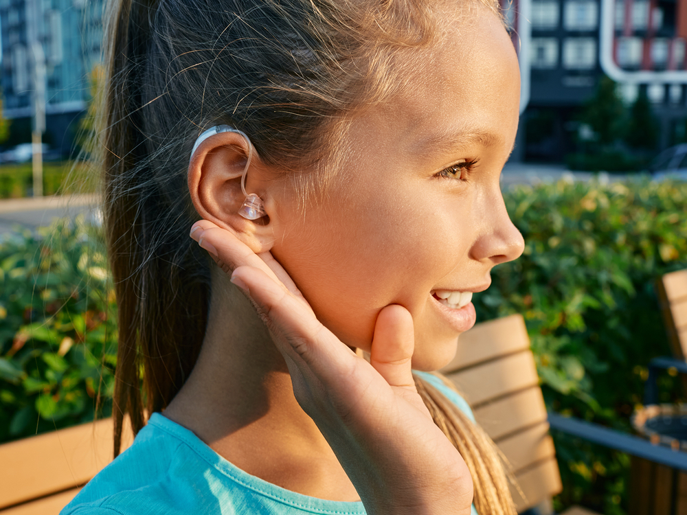 Pediatric audiologist Dr. Beverly Lew, Au.D. fitting a child with hearing aids at Sound Advice in Burbank, CA