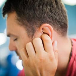 Man suffering from tinnitus