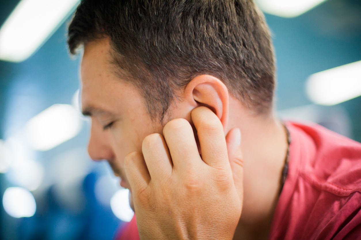 Man suffering from tinnitus